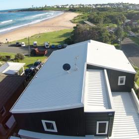 A photo of a home with a LYSAGHT® roof, built overlooking the ocean