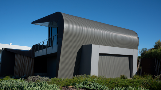 Explore a Middleton residential project where architectural cladding supports a distinctive wave form, whilst addressing the realities of a coastal environment