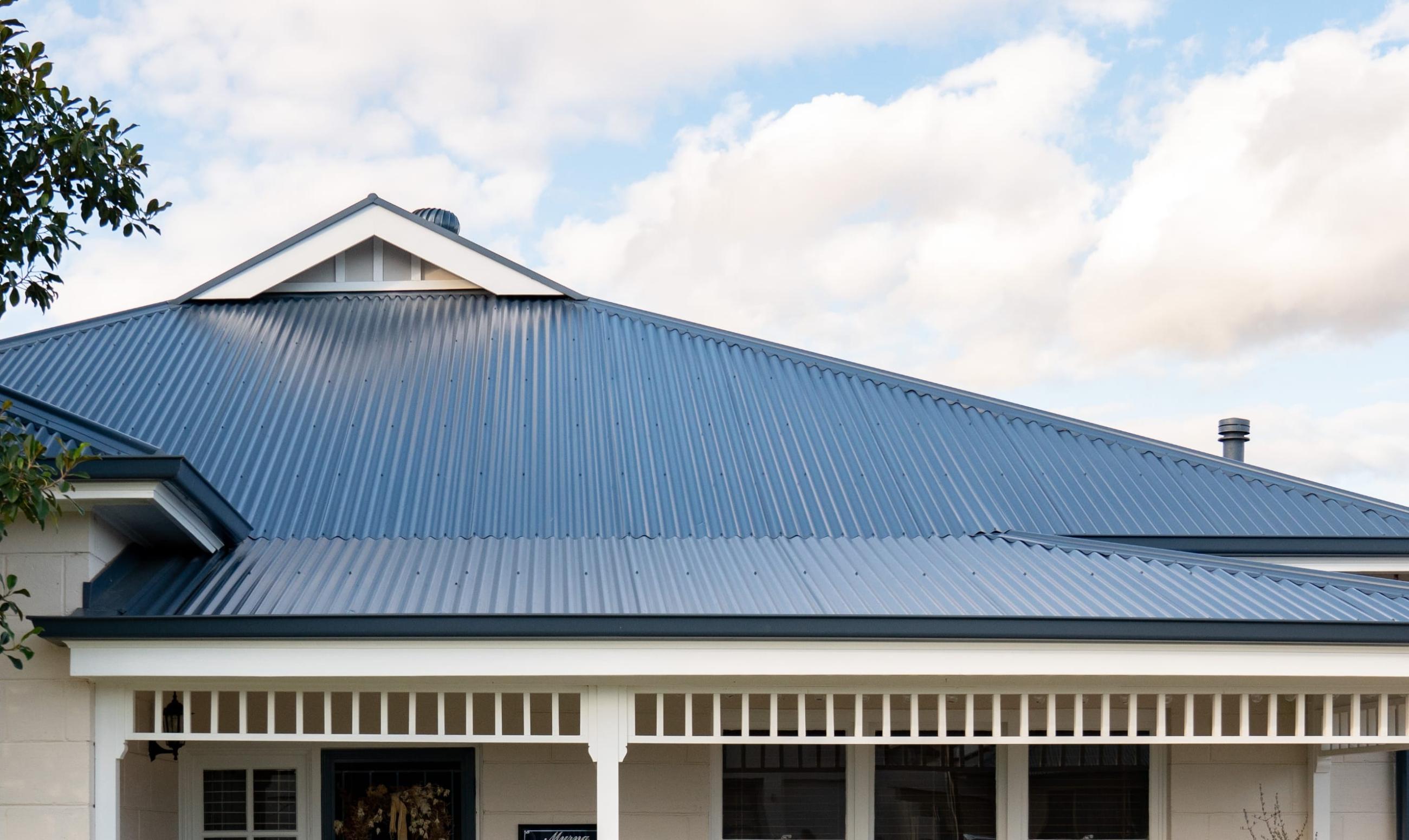 House with CUSTOM ORB ACCENT steel roofing manufactured from COLORBOND steel in colour Basalt