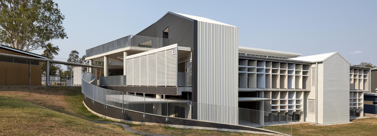 Goodna State School amongst the rural backyard which uses a range of Lysaght ZENITH® Architectural Cladding.