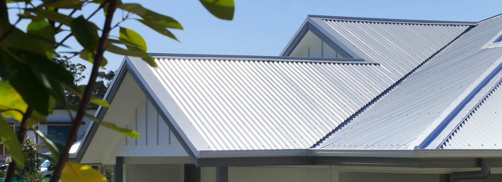Gable roof with steel sheets and neatly detailed flashings designed for effective weatherproofing roof edges.