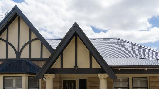 Heritage design house featuring Lysaght CUSTOM ORB® roofing in Monument®