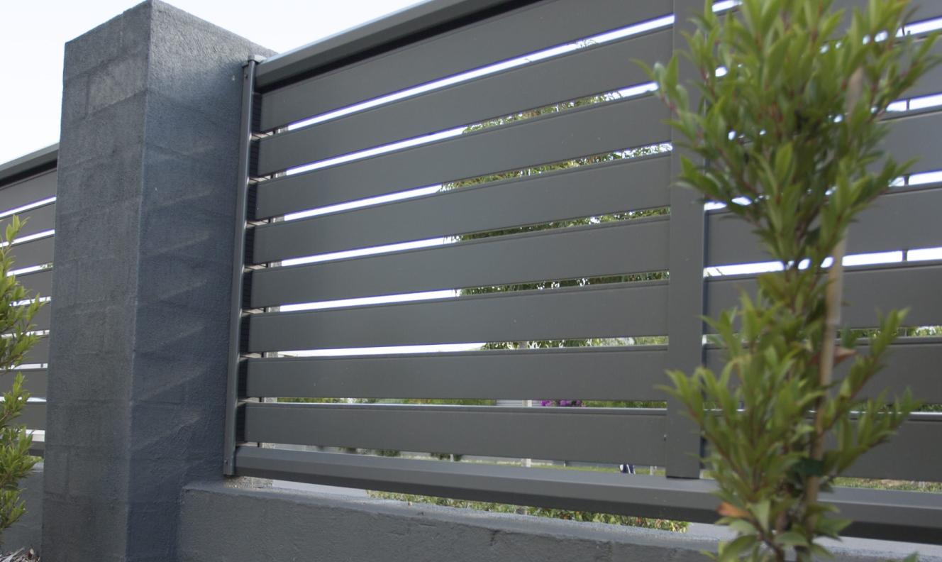 SLATSCREEN fencing made from COLORBOND steel in colour Woodland Grey